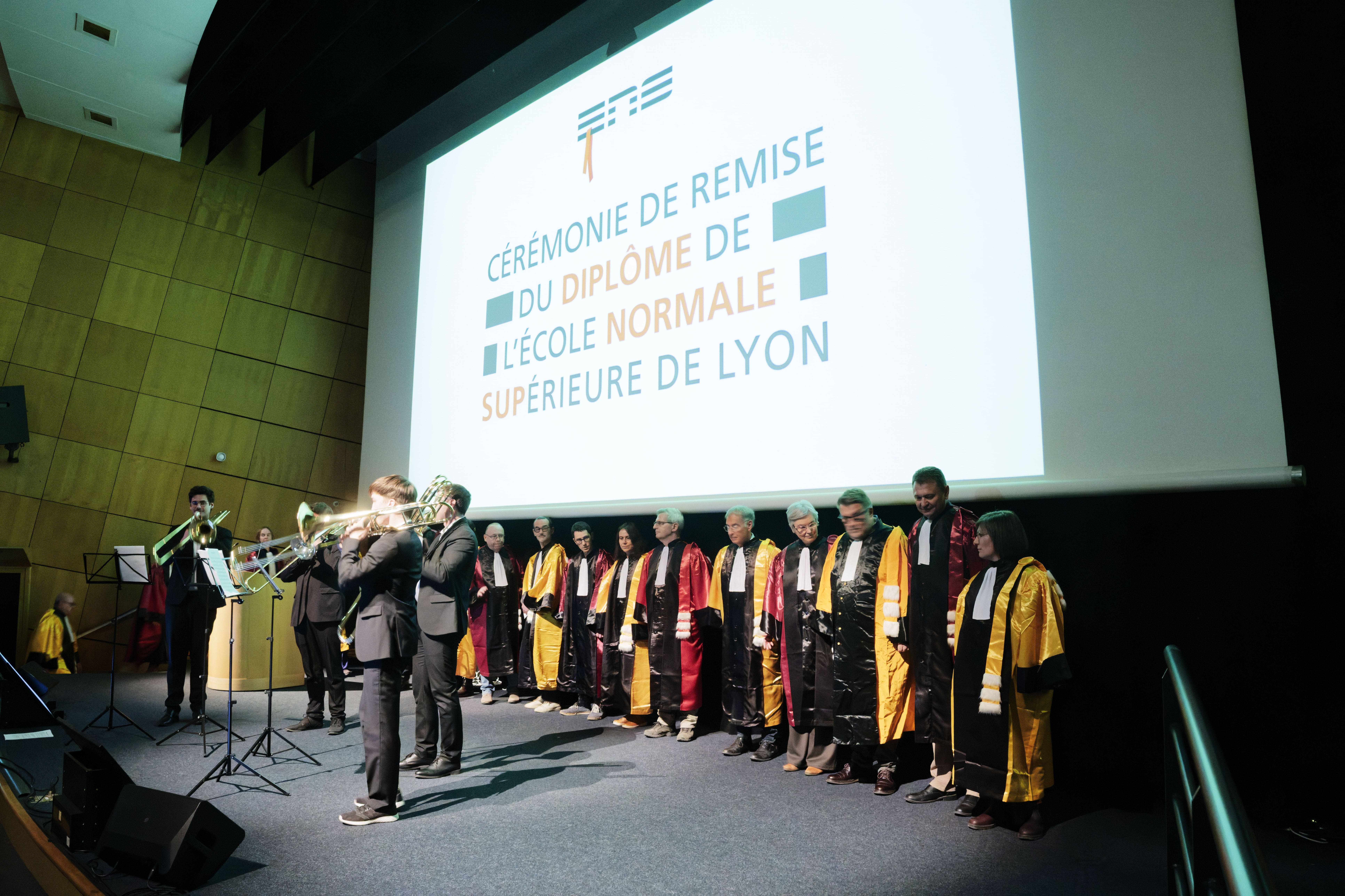 Musicians and faculty members on the Graduation Ceremony stage