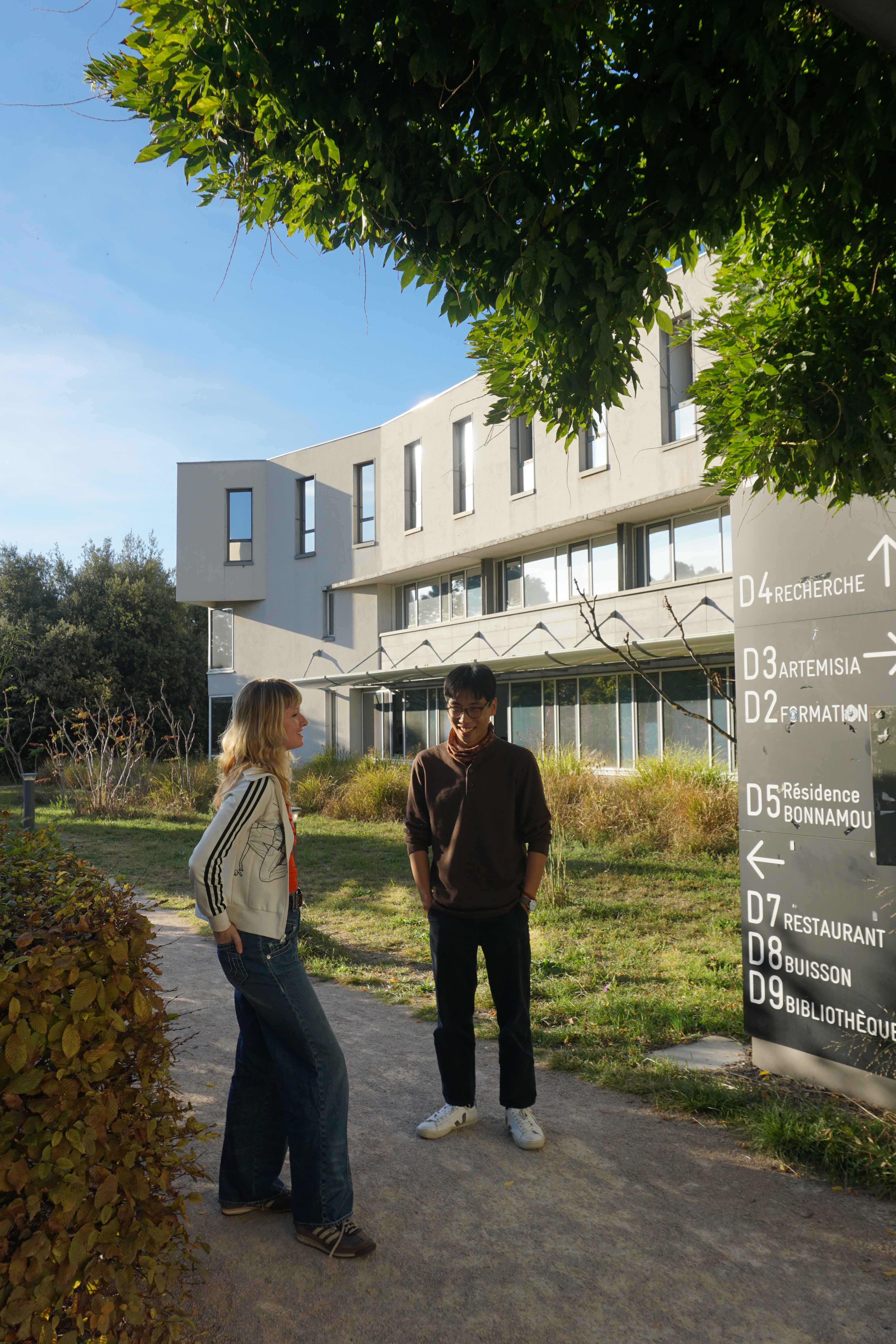 Josephine O'Brien and Ernest Leong in Descartes campus garden.