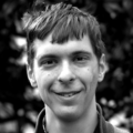 Collective effects far from equilibrium: from active flows to minimal models