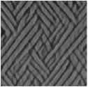 Softening-induced instability of a stretched cohesive granular layer