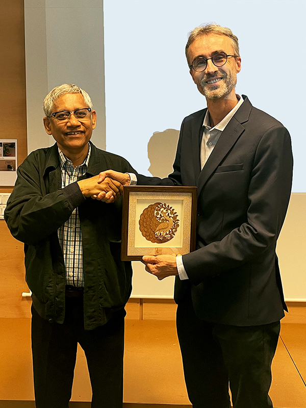 Santanu Bhattacharya and Emmanuel Trizac shake hands